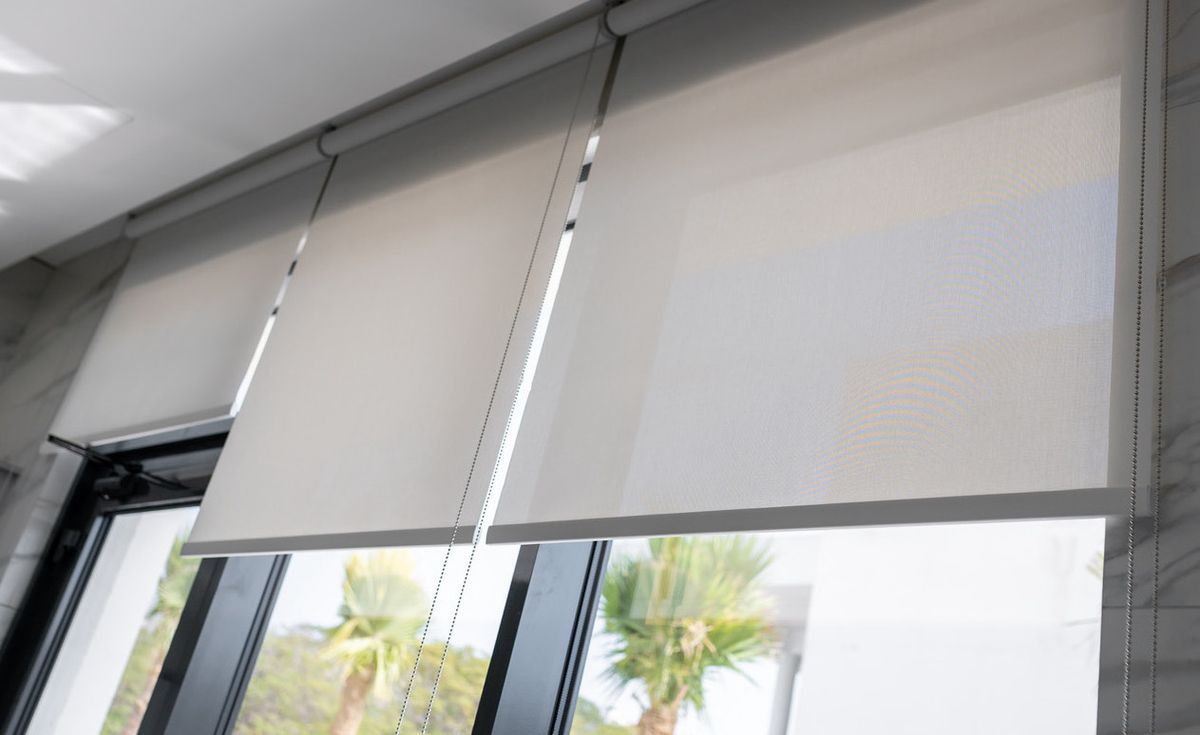 Sunscreen roller blinds on a Dubai apartment window
